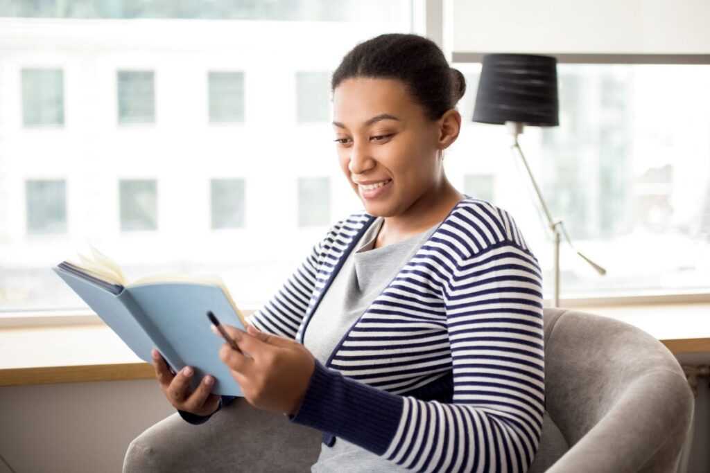 A young woman reading a book.